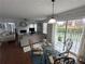 Bright living room with a fireplace, hardwood floors, comfortable seating, and sliding glass doors to the deck at 525 Dunagan Dr, Lawrenceville, GA 30045