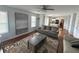 Spacious living room with hardwood floors, ceiling fan, and view of the kitchen at 525 Dunagan Dr, Lawrenceville, GA 30045