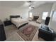 Main bedroom with fireplace, ceiling fan, sitting area, and neutral carpet at 525 Dunagan Dr, Lawrenceville, GA 30045