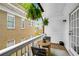 Charming balcony with wooden deck, potted plants, and seating for relaxing outdoors at 653 N Highland Ne Ave # 3, Atlanta, GA 30306