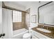 Stylish bathroom with granite countertop, tiled shower, and modern fixtures at 653 N Highland Ne Ave # 3, Atlanta, GA 30306