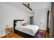 Cozy bedroom with hardwood floors, a ceiling fan, and a neutral color palette at 653 N Highland Ne Ave # 3, Atlanta, GA 30306
