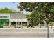 Street view of Sweet Auburn restaurant with awning and greenery on a quiet neighborhood street at 653 N Highland Ne Ave # 3, Atlanta, GA 30306