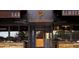 Exterior of modern restaurant entrance with wooden accents and greenery at 653 N Highland Ne Ave # 3, Atlanta, GA 30306