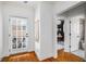 Bright hallway with hardwood floors leading to office space and bathroom at 653 N Highland Ne Ave # 3, Atlanta, GA 30306