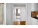 Hallway leading to a bathroom with tiled shower, offering a view of the elegant space at 653 N Highland Ne Ave # 3, Atlanta, GA 30306