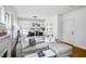Well-lit living room featuring a comfortable sofa, fireplace, and view into the dining area at 653 N Highland Ne Ave # 3, Atlanta, GA 30306