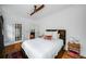 Bedroom showcasing hardwood floors, neutral color palette, and access to an ensuite bathroom at 653 N Highland Ne Ave # 3, Atlanta, GA 30306