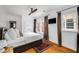 Bright bedroom with hardwood floors, a ceiling fan, and windows with curtains at 653 N Highland Ne Ave # 3, Atlanta, GA 30306