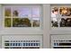 Close-up of windows showing the external view of other properties and trees at 653 N Highland Ne Ave # 3, Atlanta, GA 30306