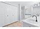 Bright bathroom with a double vanity, lots of storage, and glass shower at 221 The Esplanade Se Way, Loganville, GA 30052