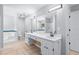 Large bathroom with double vanity, tub, and separate shower at 221 The Esplanade Se Way, Loganville, GA 30052