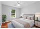 Cozy bedroom with hardwood floors, neutral decor, and ample natural light at 221 The Esplanade Se Way, Loganville, GA 30052