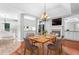 Dining room with light-toned walls, wooden dining table, and modern chandelier at 221 The Esplanade Se Way, Loganville, GA 30052