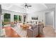 Bright living room with ample seating, tray ceiling, and natural light from the sliding doors at 221 The Esplanade Se Way, Loganville, GA 30052