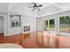 Living room with hardwood floors, fireplace, recessed lighting, and sliding glass doors at 221 The Esplanade Se Way, Loganville, GA 30052