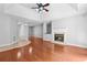 Living room with hardwood floors, fireplace, recessed lighting, and hardwood floors at 221 The Esplanade Se Way, Loganville, GA 30052