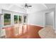 Living room with hardwood floors, recessed lighting, tray ceilings, and sliding glass doors at 221 The Esplanade Se Way, Loganville, GA 30052