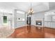 Bright living room with hardwood floors, fireplace, and French doors at 221 The Esplanade Se Way, Loganville, GA 30052