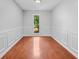 An empty room featuring hardwood floors, recessed lighting, and a view from the window at 221 The Esplanade Se Way, Loganville, GA 30052