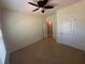 Bright bedroom with neutral walls, standard closet and ceiling fan and carpeted floors at 288 Blue Pointe Ct, Suwanee, GA 30024