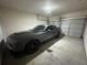 Attached garage with a clean and well-maintained concrete floor, bright light, and overhead door at 288 Blue Pointe Ct, Suwanee, GA 30024