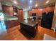 Spacious kitchen featuring stainless steel appliances, granite counters, central island and views to dining at 288 Blue Pointe Ct, Suwanee, GA 30024