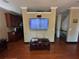 Open-concept room features a TV, crown molding, and access to adjacent rooms at 288 Blue Pointe Ct, Suwanee, GA 30024