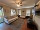 Cozy living room featuring a ceiling fan and a comfortable seating area with natural light at 288 Blue Pointe Ct, Suwanee, GA 30024