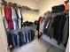 Walk-in closet with wire shelving for optimal storage of clothes, hats and shoes at 288 Blue Pointe Ct, Suwanee, GA 30024