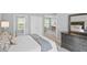 Bedroom featuring a neatly made bed, dresser, and open entry to an adjacent room at 4922 Carson Glen Ln, Acworth, GA 30101