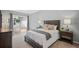 Bedroom featuring a neatly made bed, sliding glass door and access to outdoor patio at 4922 Carson Glen Ln, Acworth, GA 30101