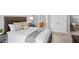 Bedroom view featuring a neatly made bed, nightstand, and open entry to ensuite bathroom at 4922 Carson Glen Ln, Acworth, GA 30101