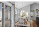 Cozy dining room featuring a modern chandelier, dining table, and patio access at 4922 Carson Glen Ln, Acworth, GA 30101