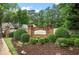 Community entrance featuring signage for The Cottages at Baker Road and lush landscaping at 4922 Carson Glen Ln, Acworth, GA 30101