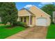 Charming home showcasing its manicured lawn, a paved driveway, and an attached one car garage at 4922 Carson Glen Ln, Acworth, GA 30101