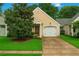 Inviting single Gathering home with manicured lawn, paved driveway, and attached single car garage at 4922 Carson Glen Ln, Acworth, GA 30101