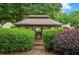 Exterior view of a gazebo surrounded by lush greenery and landscaping at 4922 Carson Glen Ln, Acworth, GA 30101