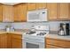 Kitchen features a stove with an over-the-range microwave at 4922 Carson Glen Ln, Acworth, GA 30101