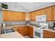 Spacious kitchen featuring laminate counters, a stove, and lots of cabinet space at 4922 Carson Glen Ln, Acworth, GA 30101