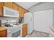 Bright kitchen features white appliances, and lots of storage at 4922 Carson Glen Ln, Acworth, GA 30101