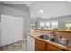 Open kitchen features a stainless sink, laminate counter, and hardwood floors at 4922 Carson Glen Ln, Acworth, GA 30101