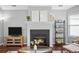 Comfortable living room featuring a fireplace, television, and hardwood floors at 4922 Carson Glen Ln, Acworth, GA 30101