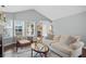 Inviting living room featuring comfortable seating, a fireplace, and hardwood floors at 4922 Carson Glen Ln, Acworth, GA 30101