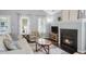 Charming living room featuring a fireplace, hardwood floors, and lots of natural light at 4922 Carson Glen Ln, Acworth, GA 30101