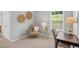 Well-lit office area with a chair, side table, and desk at 4922 Carson Glen Ln, Acworth, GA 30101