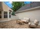 Outdoor patio features stone pavers, seating, and lots of light at 4922 Carson Glen Ln, Acworth, GA 30101