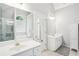 Bright bathroom with double sinks, lots of counterspace, bathtub, and a glass shower at 1010 Capella Creek Way, Grayson, GA 30017