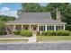 Community clubhouse with manicured landscaping and sidewalk access at 1010 Capella Creek Way, Grayson, GA 30017