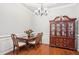 Dining room featuring hardwood floors, chandelier, a table with four chairs and a hutch at 1010 Capella Creek Way, Grayson, GA 30017